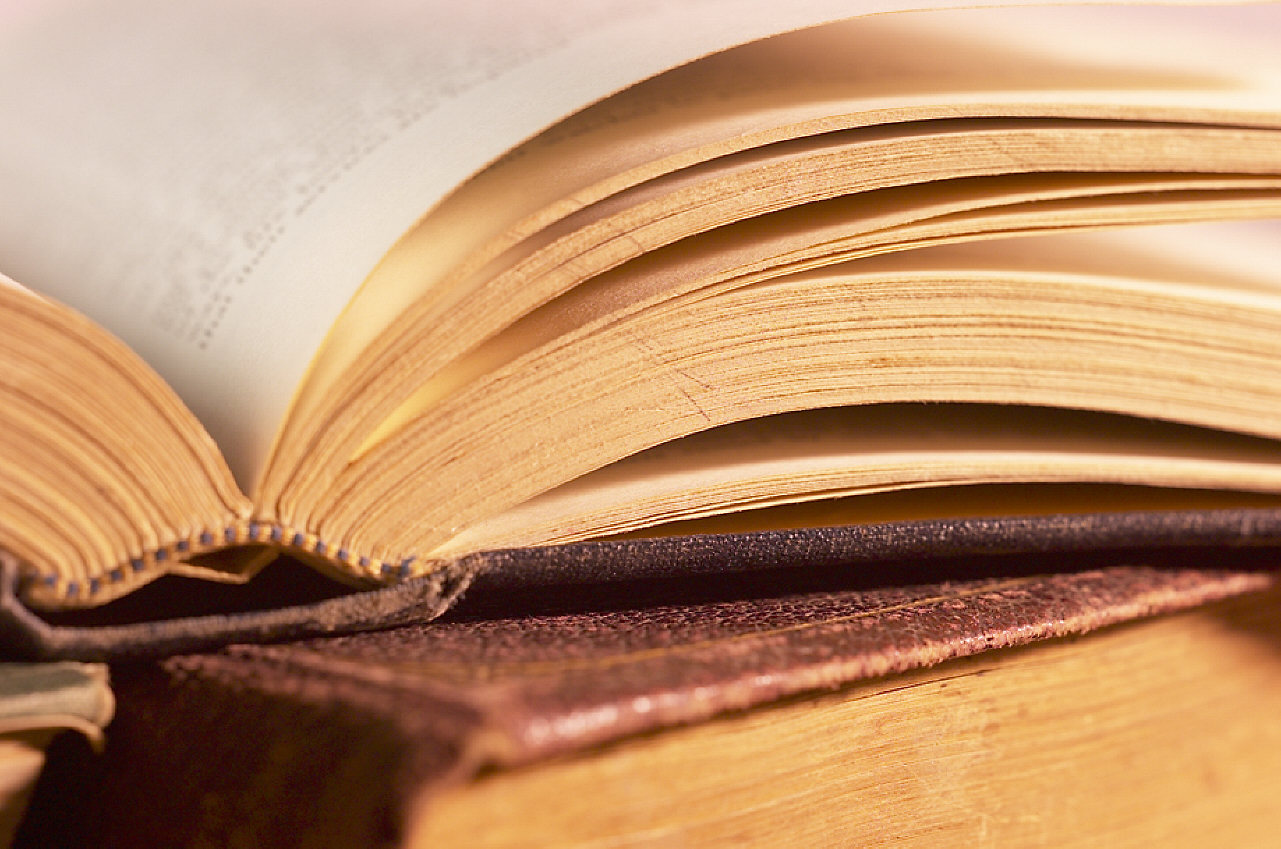 open-book-on-top-of-pile-of-books1[1]